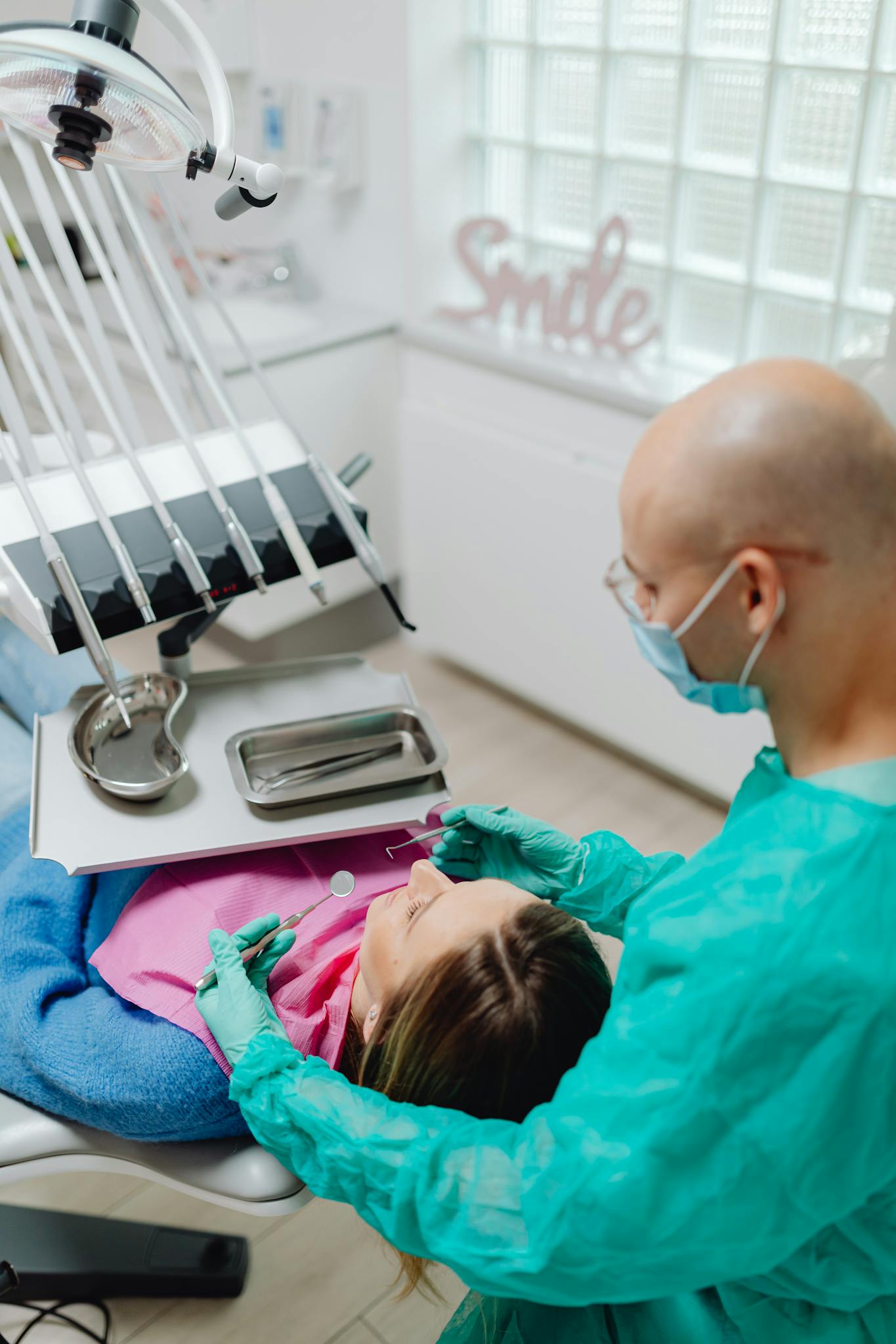 Patient receiving dental checkup from professional in a modern clinic.